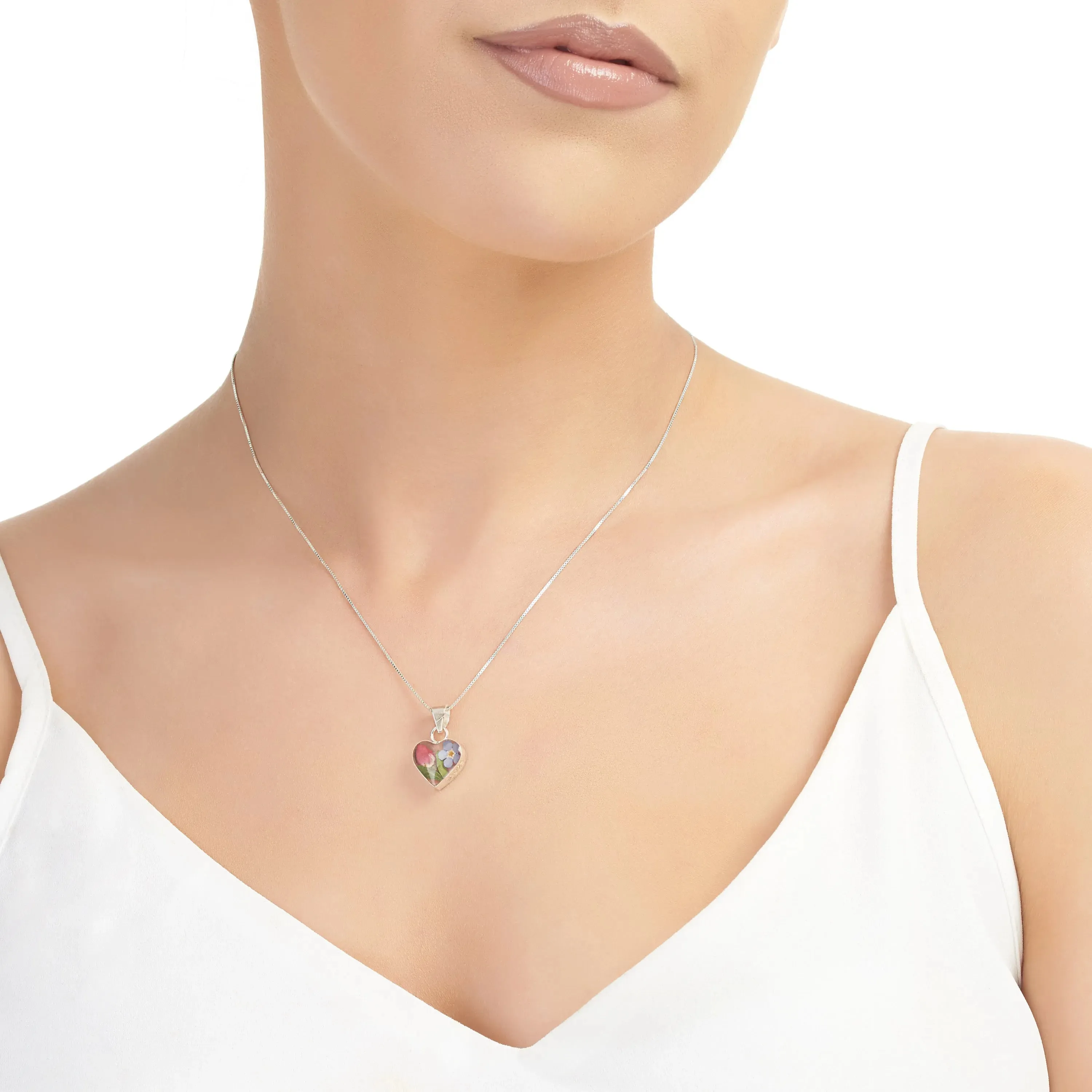 Sterling silver heart pendant with a real forget-me-not & miniature rose. Romantic valentine jewellery gift.